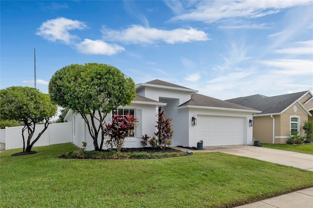 view of front of property with a front yard and a garage