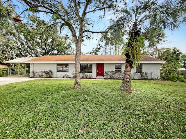 ranch-style house with a carport and a front yard