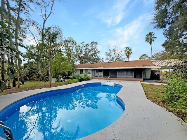 view of swimming pool featuring a patio area