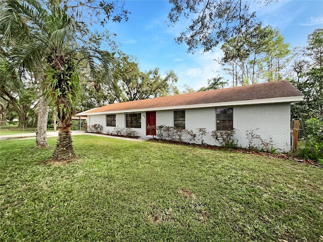 ranch-style home with a front yard