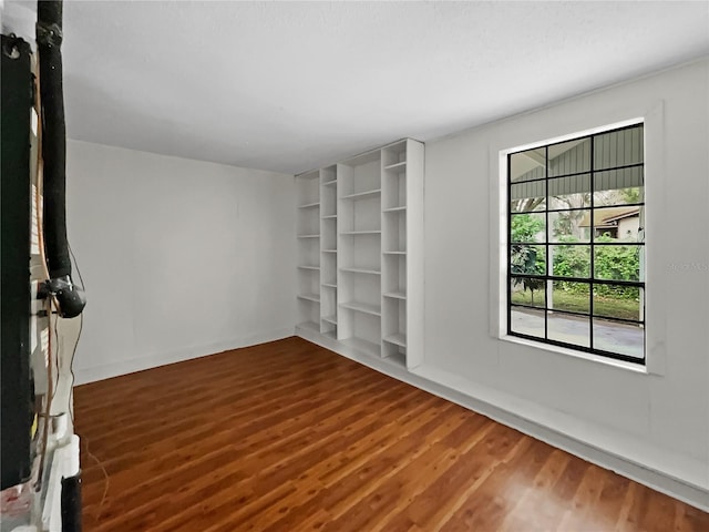 empty room featuring dark wood-type flooring