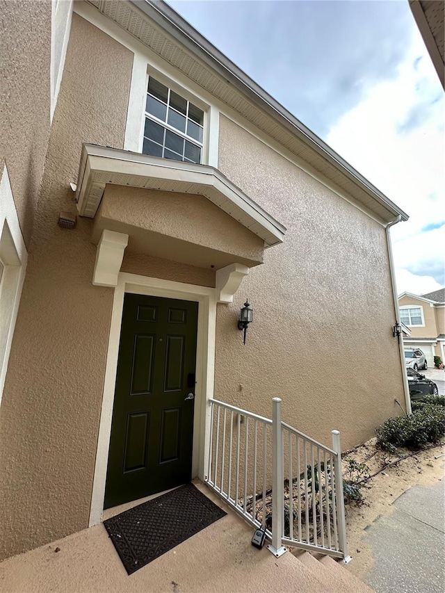 property entrance with covered porch