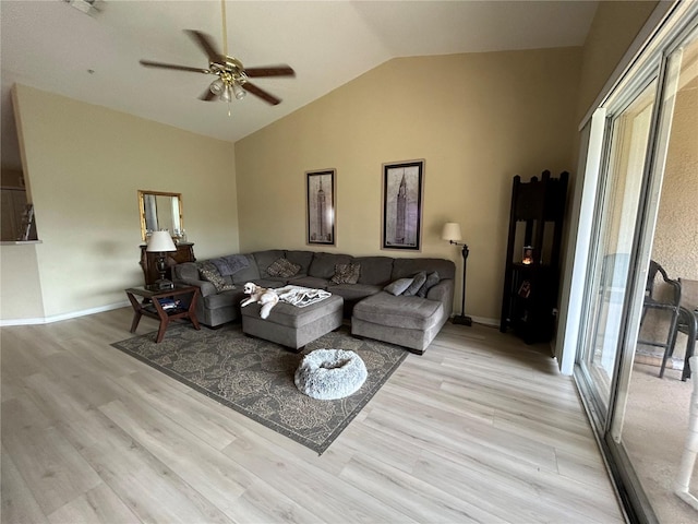 living room with ceiling fan, light hardwood / wood-style flooring, and vaulted ceiling