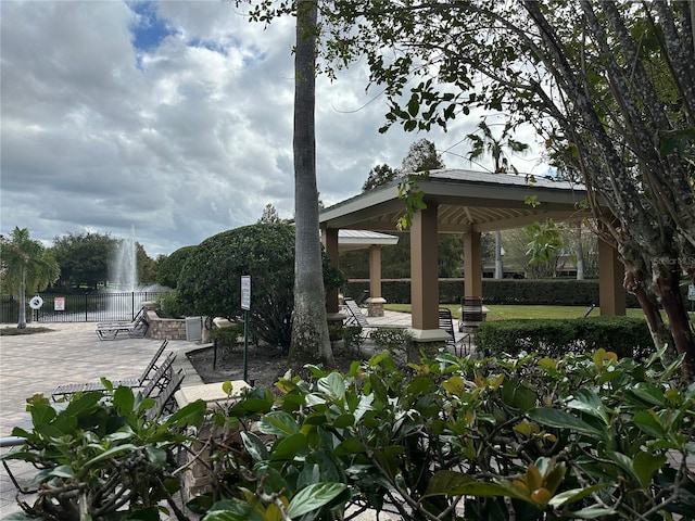 view of patio / terrace featuring a water view and a gazebo