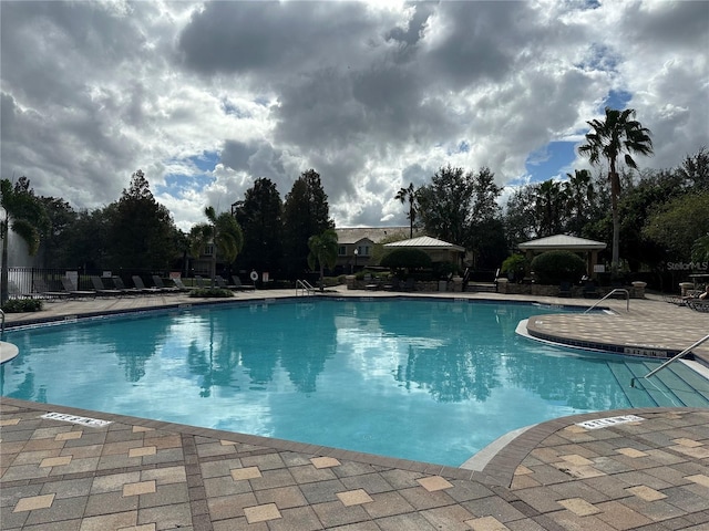 view of swimming pool with a patio