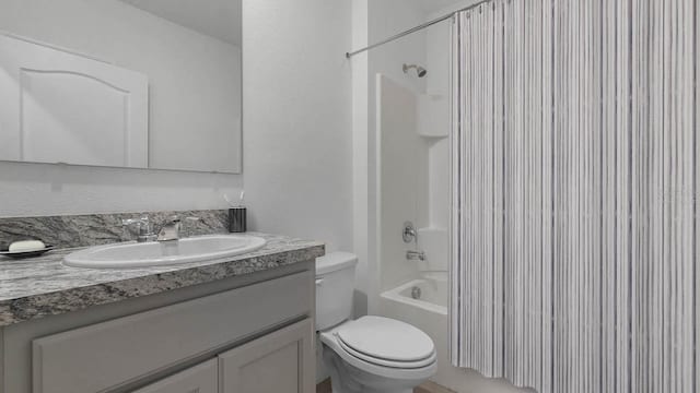 full bathroom with vanity, bathing tub / shower combination, and toilet