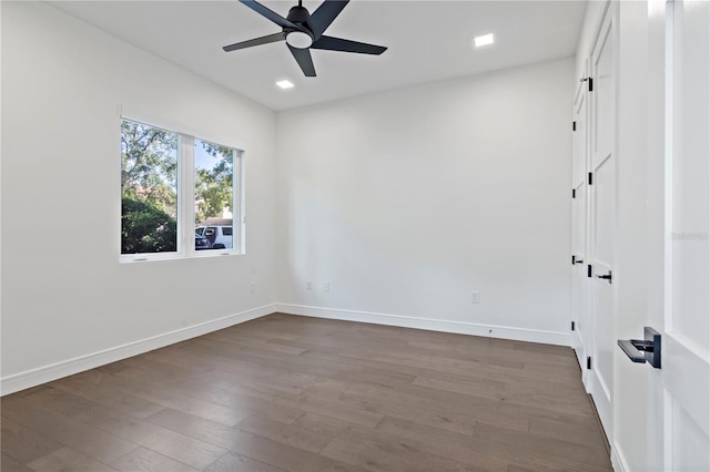 spare room with wood-type flooring and ceiling fan