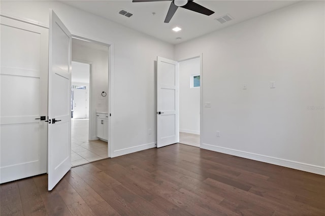 unfurnished bedroom featuring ceiling fan and wood-type flooring