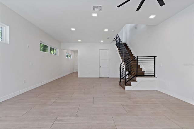 interior space featuring ceiling fan