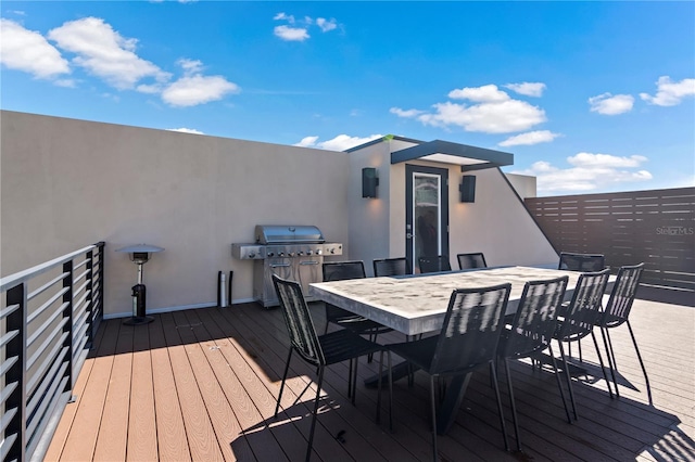 wooden deck with grilling area