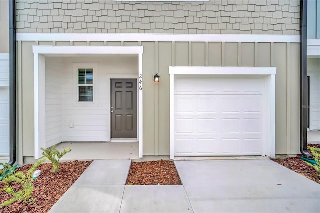 doorway to property featuring a garage