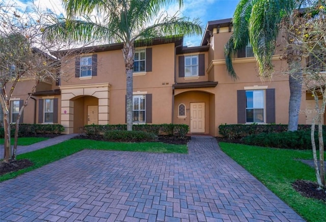 3520 Calabria Ave Unit 3520, Davenport, FL 33897 - multi unit property featuring stucco siding and a front yard