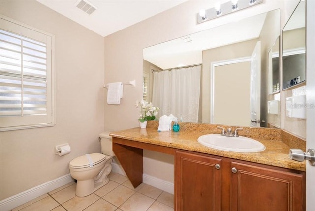 3520 Calabria Ave Unit 3520, Davenport, FL 33897 - bathroom featuring baseboards, toilet, tile patterned flooring, and vanity