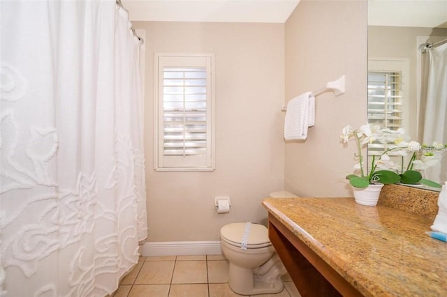 3520 Calabria Ave Unit 3520, Davenport, FL 33897 - bathroom with vanity, tile patterned floors, toilet, baseboards, and curtained shower