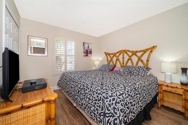 3520 Calabria Ave Unit 3520, Davenport, FL 33897 - bedroom featuring wood finished floors, a closet, and baseboards
