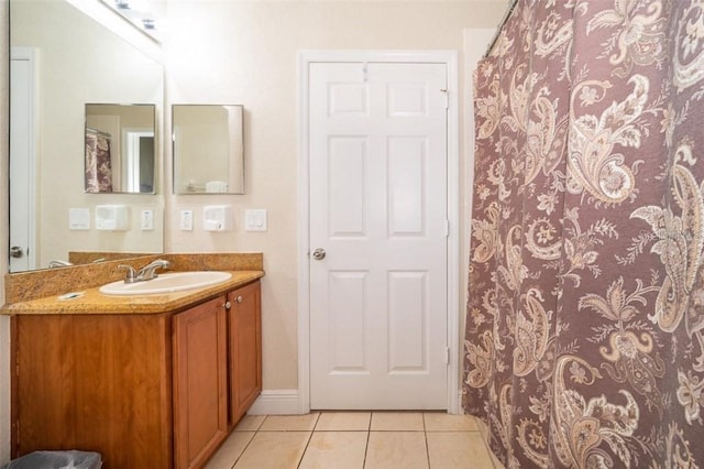 3520 Calabria Ave Unit 3520, Davenport, FL 33897 - full bathroom featuring tile patterned floors, vanity, curtained shower, and baseboards