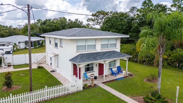 view of front of home with a front lawn