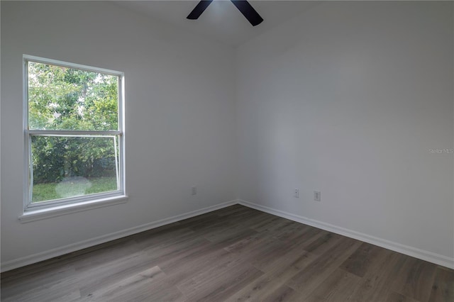 unfurnished room with dark hardwood / wood-style flooring, ceiling fan, and plenty of natural light