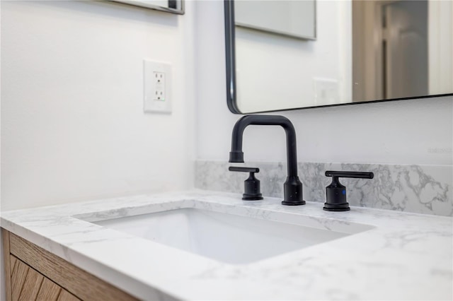 interior details featuring tasteful backsplash and vanity