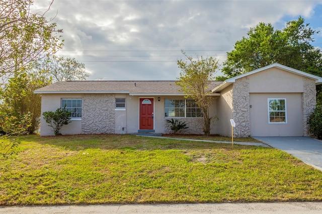 ranch-style home with a front yard