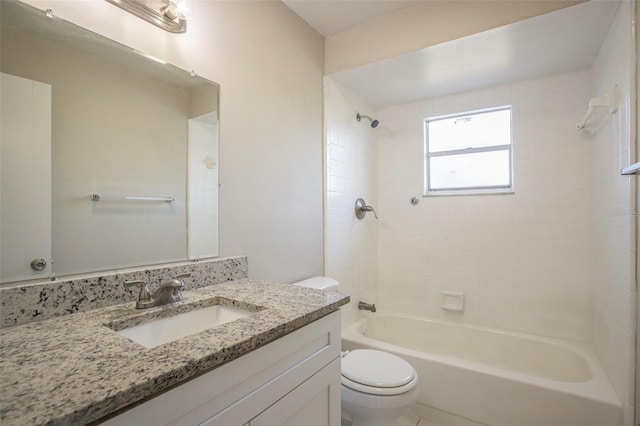 full bathroom featuring vanity, toilet, and tiled shower / bath combo