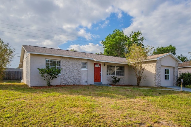 ranch-style home with a front yard