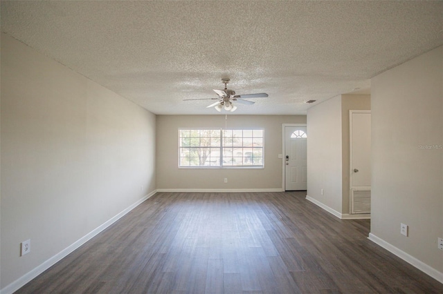 unfurnished room with ceiling fan, dark hardwood / wood-style floors, and a textured ceiling