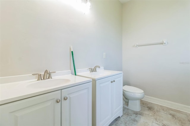 bathroom with toilet and vanity