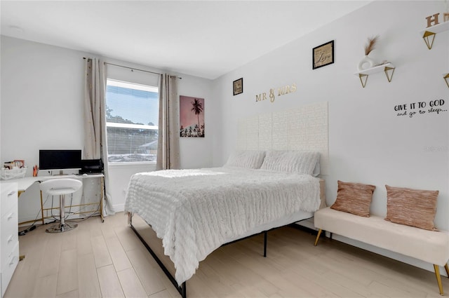 bedroom with light hardwood / wood-style floors