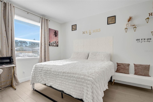 bedroom with light hardwood / wood-style floors