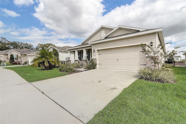 view of front of property with a garage and a front lawn