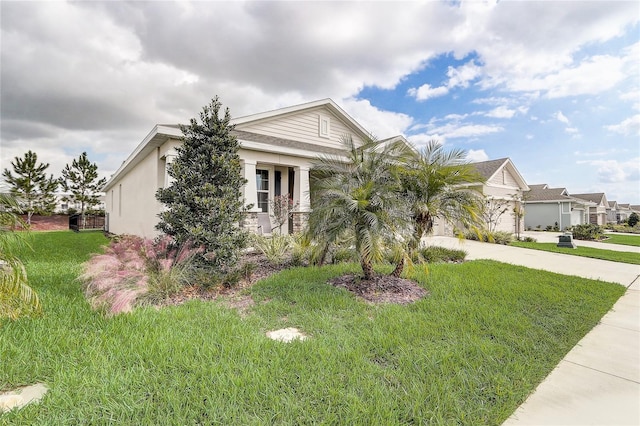 view of front of home with a garage and a front lawn