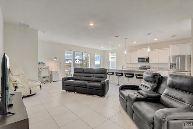 living room with light tile patterned floors