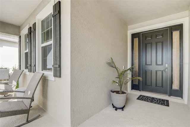 7889 Penrose Pl, Wildwood, FL 34785 - entrance to property featuring stucco siding and a porch
