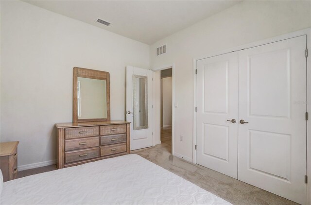 7889 Penrose Pl, Wildwood, FL 34785 - bedroom with baseboards, a closet, and light colored carpet
