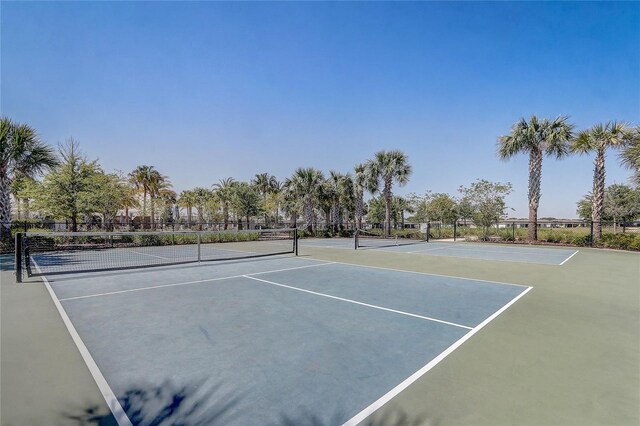 7889 Penrose Pl, Wildwood, FL 34785 - view of tennis court featuring fence and community basketball court