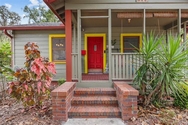 property entrance with covered porch