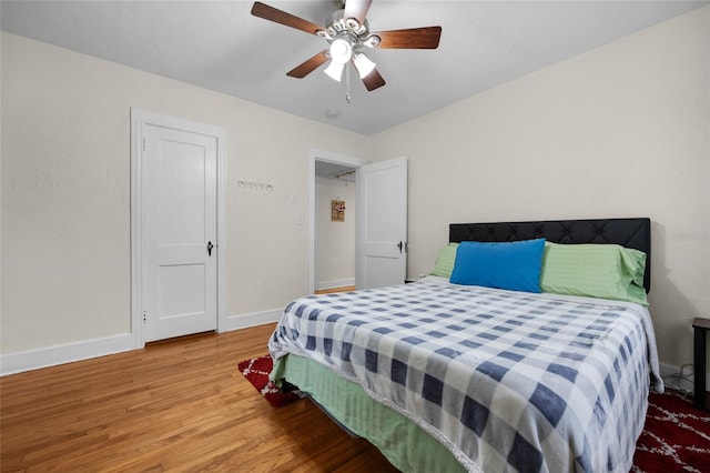 bedroom featuring hardwood / wood-style floors and ceiling fan