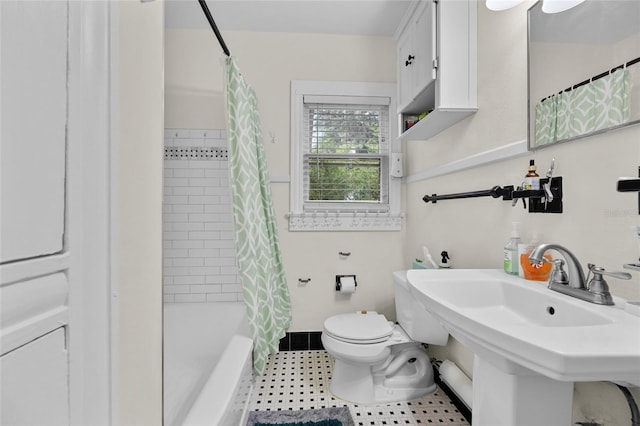 full bathroom featuring shower / bath combination with curtain, toilet, and sink