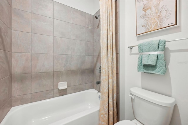 bathroom featuring toilet and shower / bathtub combination with curtain