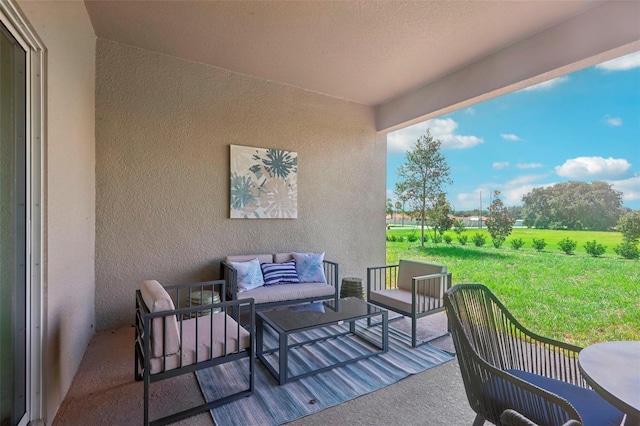 view of patio with outdoor lounge area and a rural view