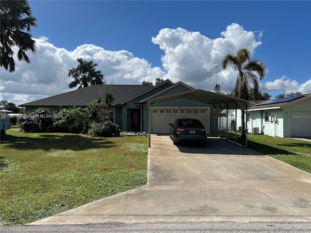 view of front of property featuring a garage, a carport, and a front yard