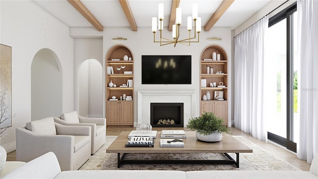 living room with a healthy amount of sunlight, built in features, and a chandelier