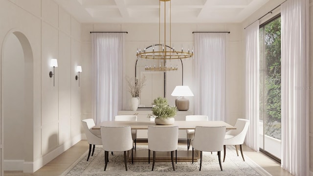 dining room featuring an inviting chandelier, beam ceiling, light hardwood / wood-style floors, and coffered ceiling