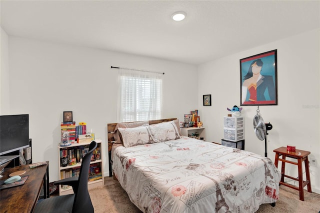 bedroom featuring light colored carpet