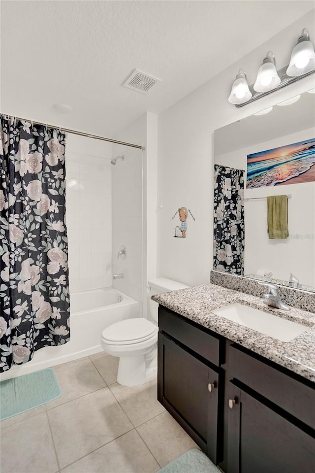 full bathroom featuring vanity, tile patterned floors, toilet, shower / bathtub combination with curtain, and a textured ceiling