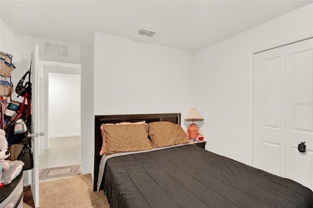 carpeted bedroom with a closet