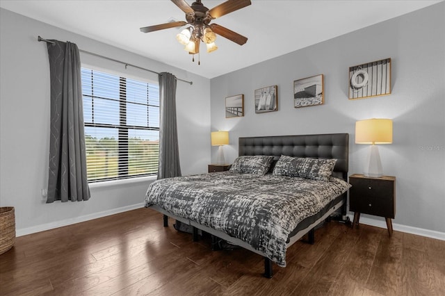 bedroom featuring dark hardwood / wood-style flooring and ceiling fan