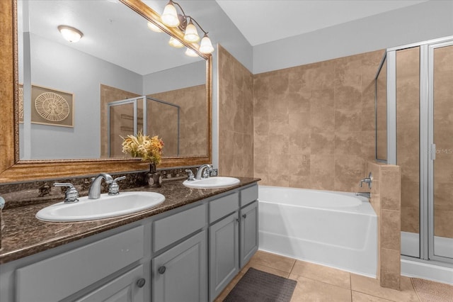 bathroom with vanity, tile patterned floors, and shower with separate bathtub