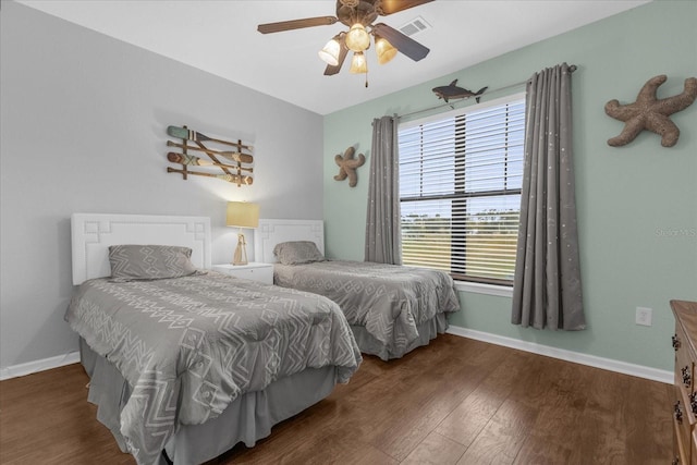 bedroom with dark wood-type flooring and ceiling fan